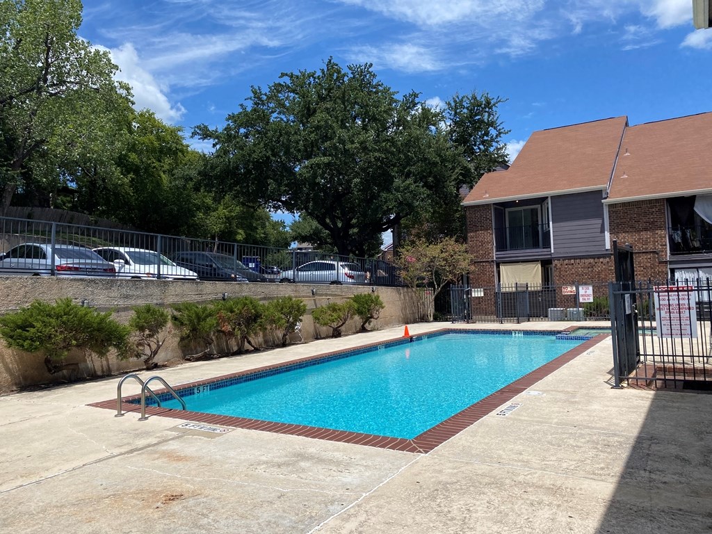 1840 Burton Drive, Unit 128 Austin, TX 78741 - Photo 20 of 22 an outdoor space with swimming pool and furniture