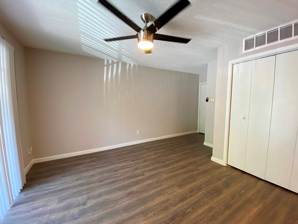 1840 Burton Drive, Unit 128 Austin, TX 78741 - Photo 4 of 22 wooden floor in an empty room