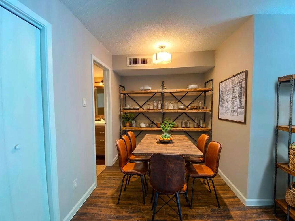 1840 Burton Drive, Unit 128 Austin, TX 78741 - Photo 9 of 22 a view of a dining room that has a table and chairs in it