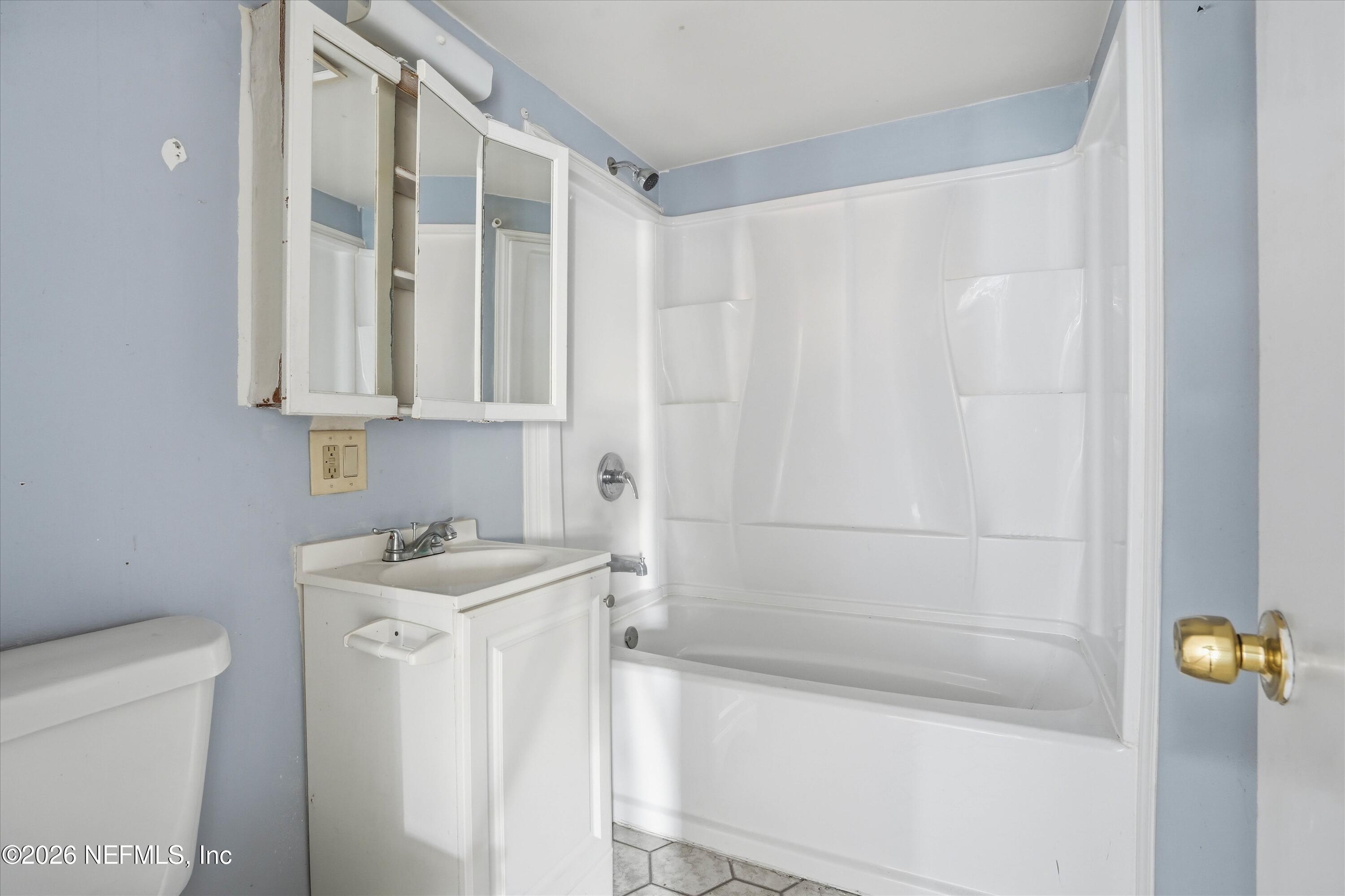 27 Julia Street St. Augustine, FL 32084 - Photo 14 of 46 a bathroom with a sink a toilet and shower