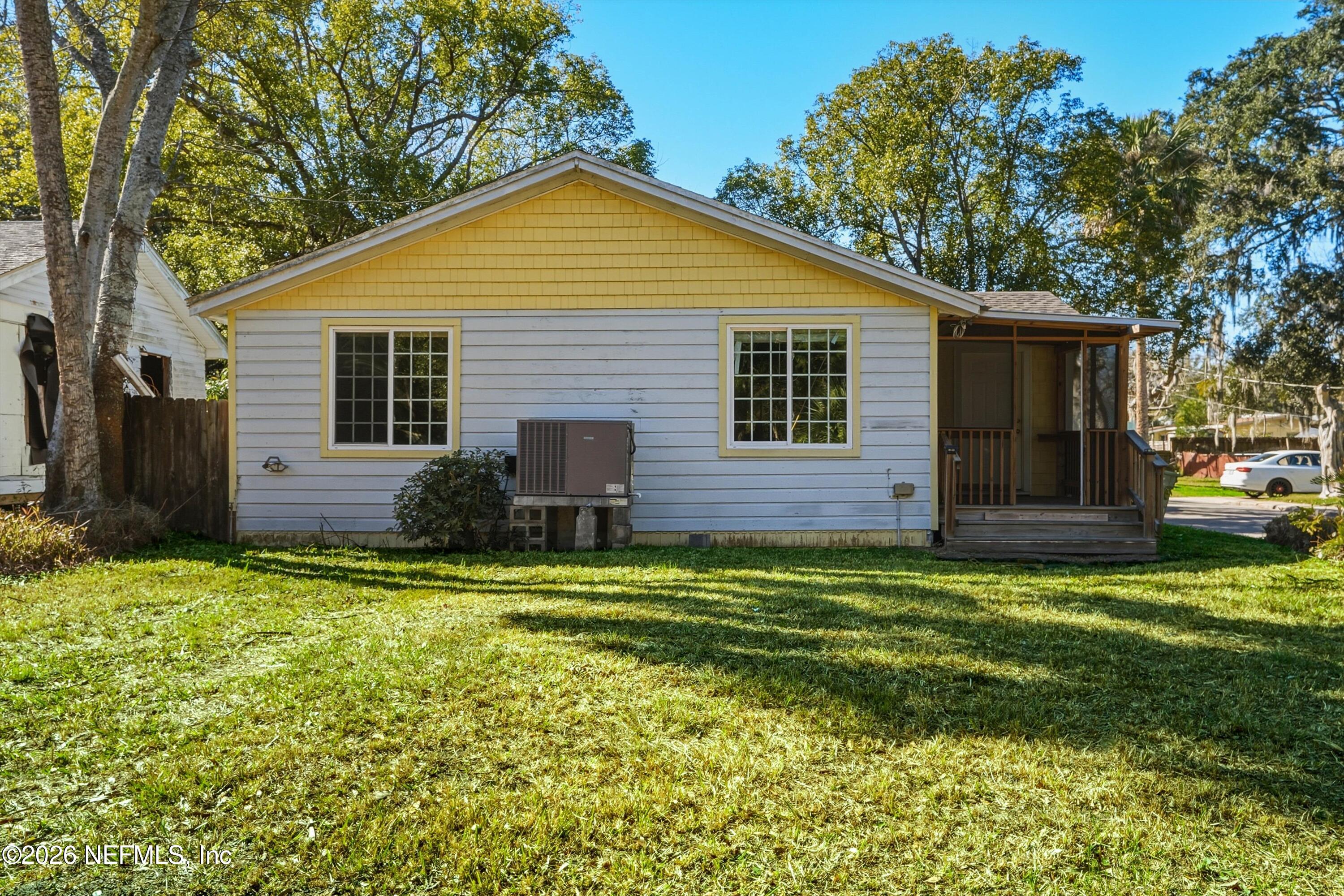 27 Julia Street St. Augustine, FL 32084 - Photo 3 of 46 a backyard of a house with yard and outdoor seating