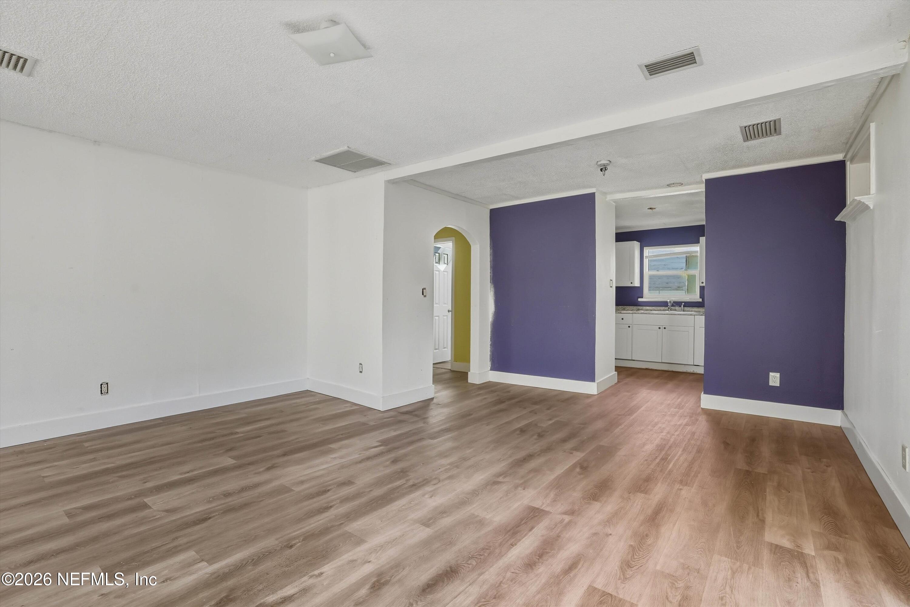 27 Julia Street St. Augustine, FL 32084 - Photo 32 of 46 a view of an empty room with wooden floor