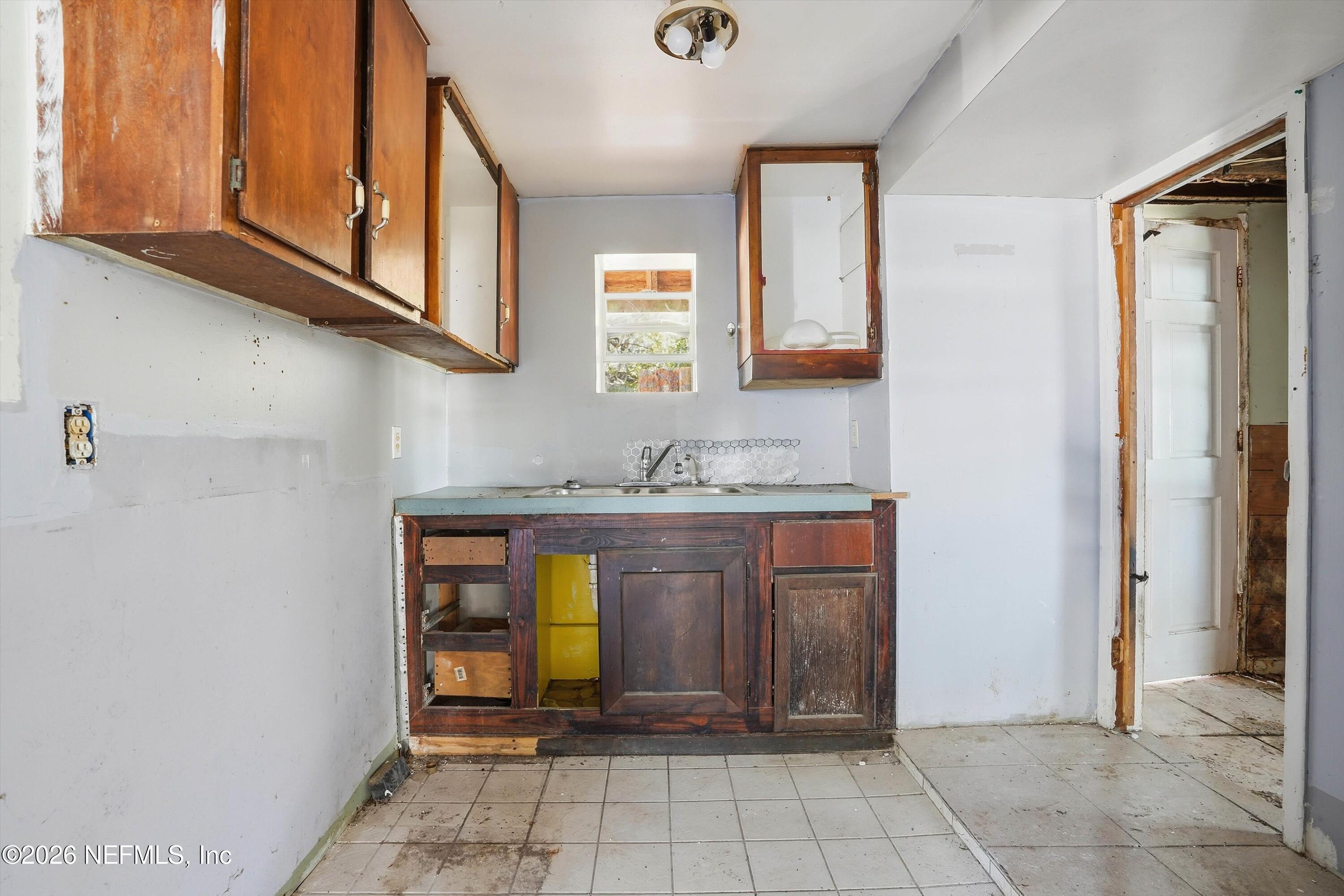 27 Julia Street St. Augustine, FL 32084 - Photo 9 of 46 a view of an entryway with wooden floor and cabinet