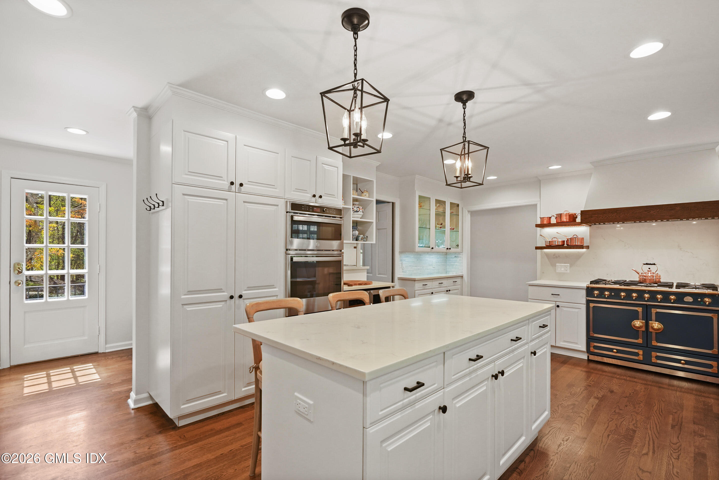 118 Butternut Hollow Road Greenwich, CT 06830 - Photo 14 of 44 a kitchen that has a cabinets a sink stainless steel appliances and wooden floor