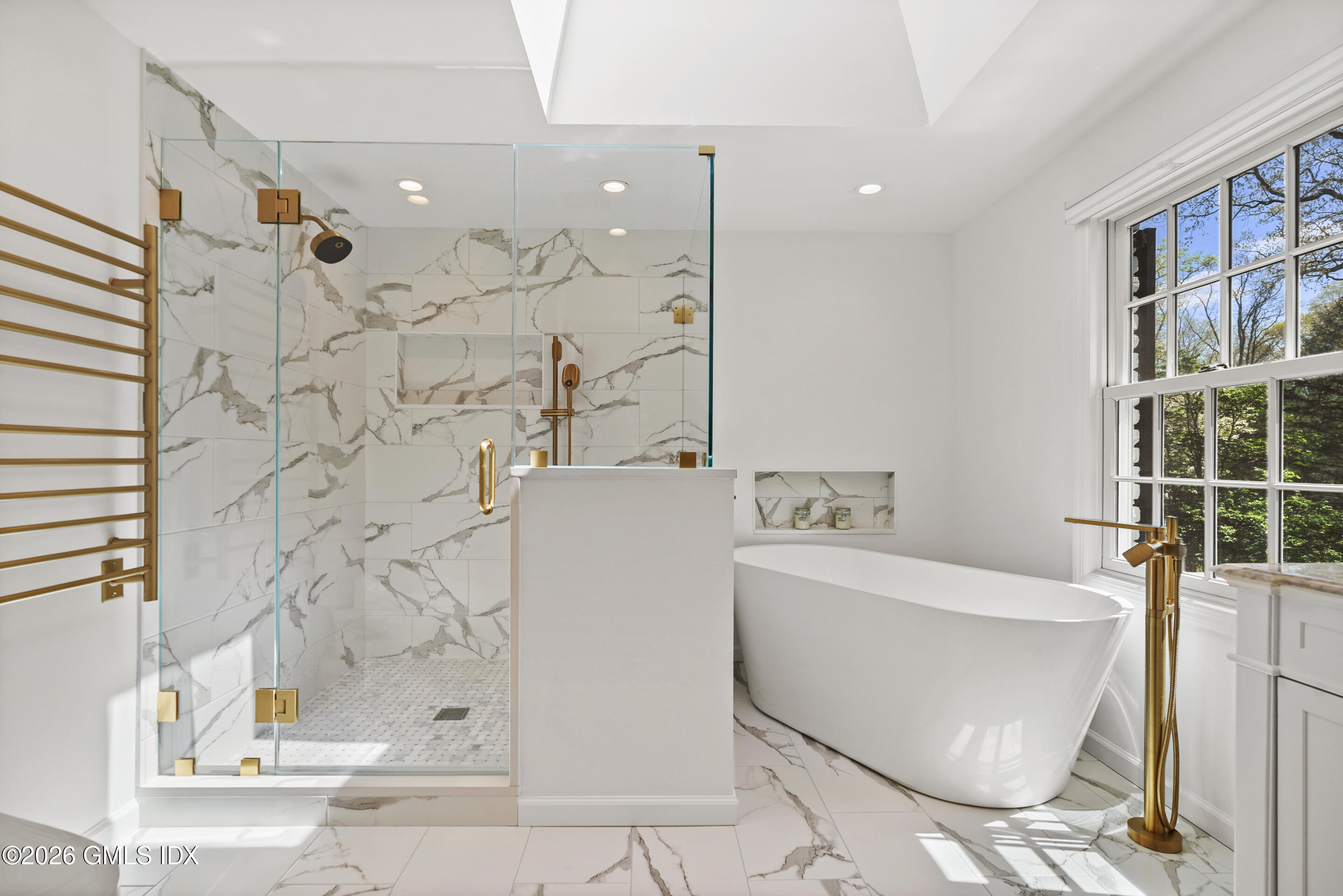 118 Butternut Hollow Road Greenwich, CT 06830 - Photo 24 of 44 a bathroom with a bathtub and a shower