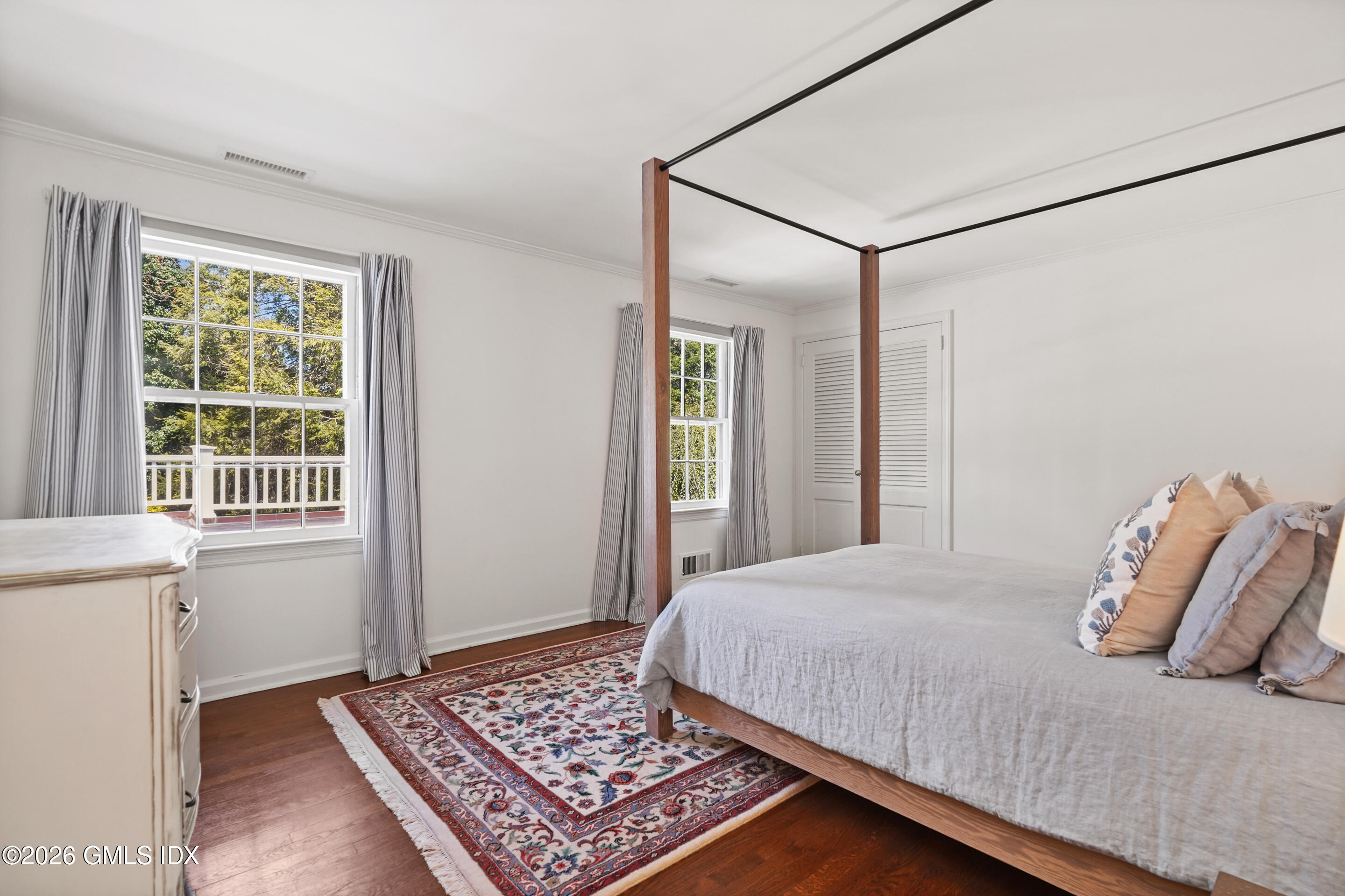 118 Butternut Hollow Road Greenwich, CT 06830 - Photo 25 of 44 a bedroom with a bed and a window with the outer view