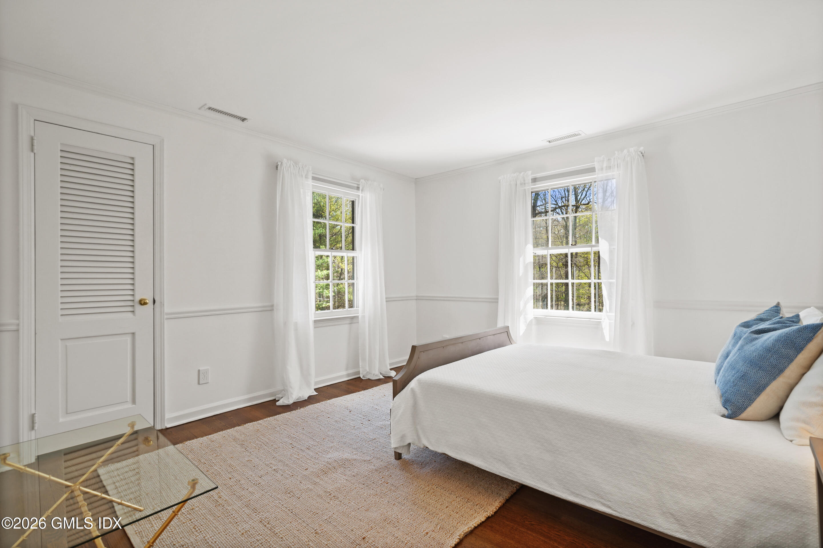 118 Butternut Hollow Road Greenwich, CT 06830 - Photo 26 of 44 a bedroom with a bed and a window
