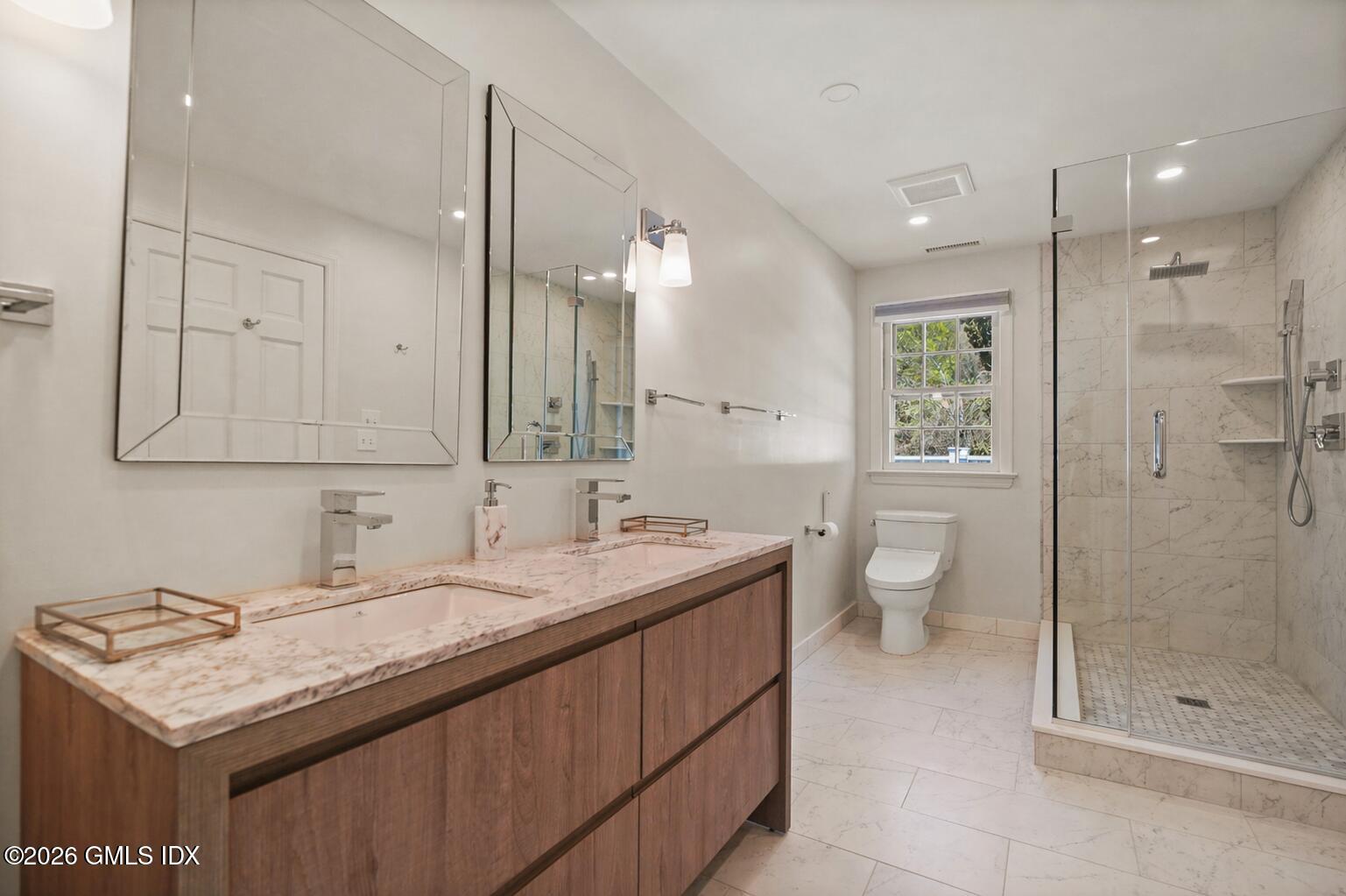 118 Butternut Hollow Road Greenwich, CT 06830 - Photo 27 of 44 a bathroom with a granite countertop sink a toilet and shower