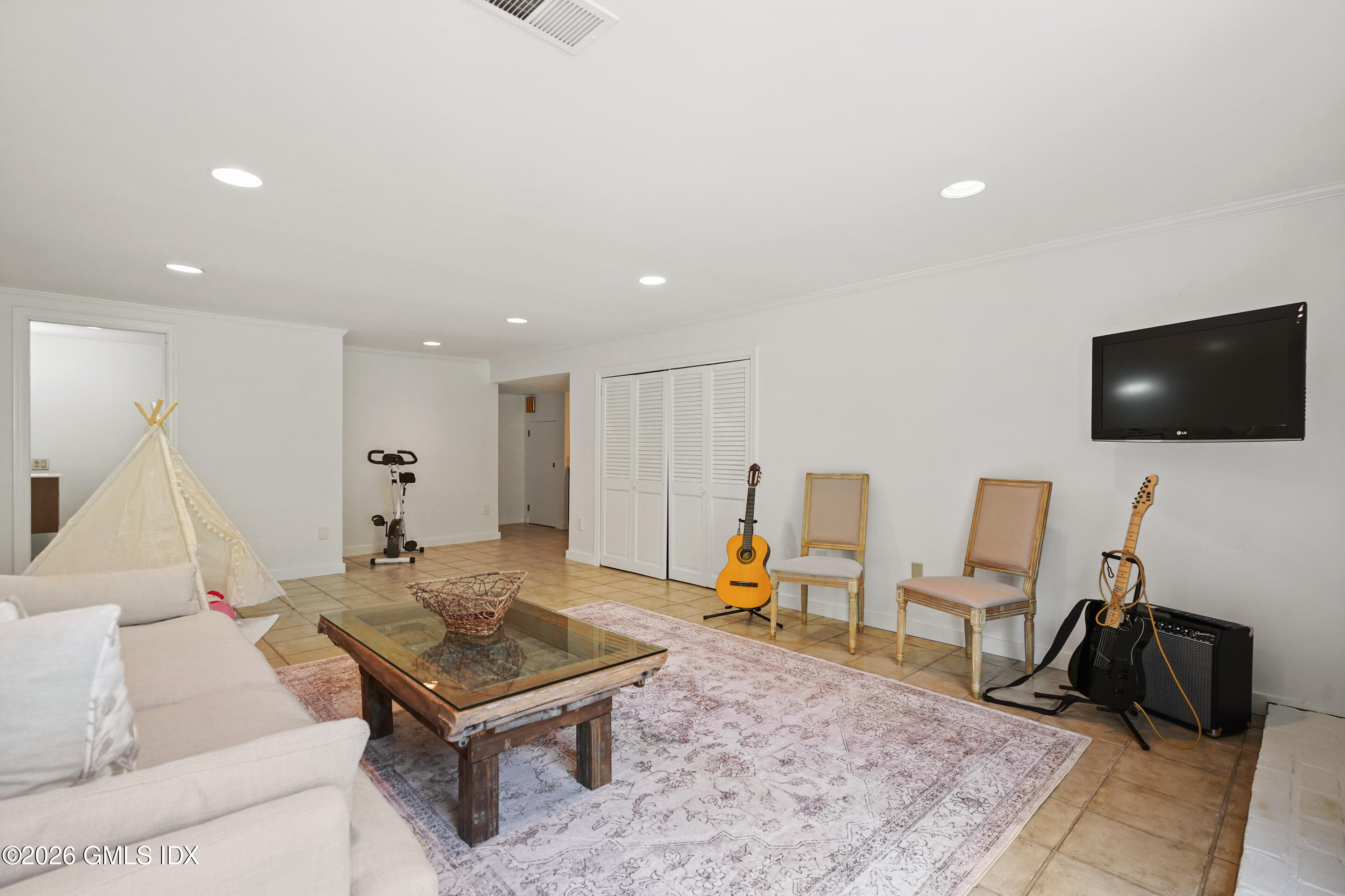 118 Butternut Hollow Road Greenwich, CT 06830 - Photo 32 of 44 a living room with furniture and a flat screen tv