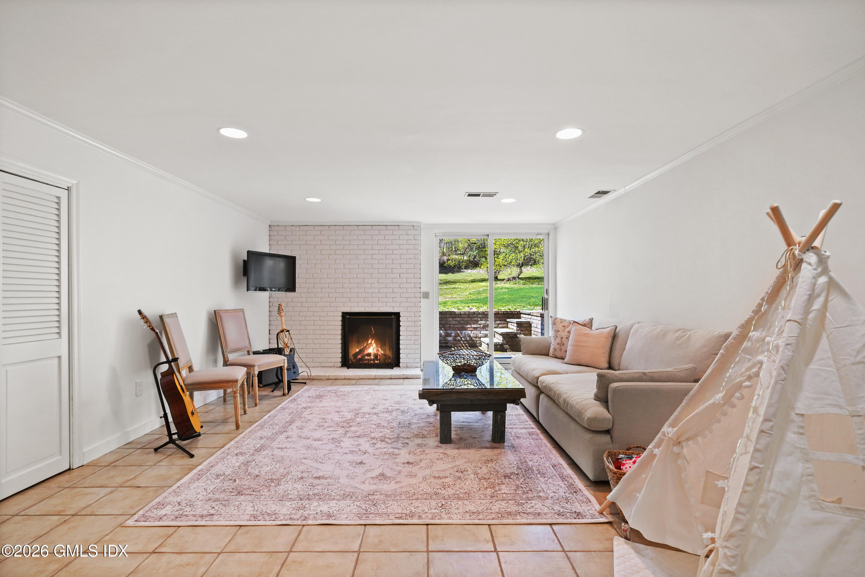 118 Butternut Hollow Road Greenwich, CT 06830 - Photo 33 of 44 a living room with furniture and a fireplace