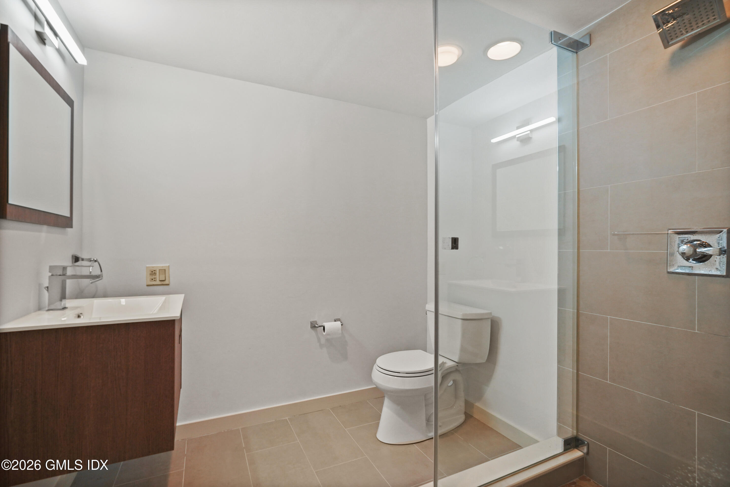 118 Butternut Hollow Road Greenwich, CT 06830 - Photo 35 of 44 a white toilet sitting next to a bathroom sink