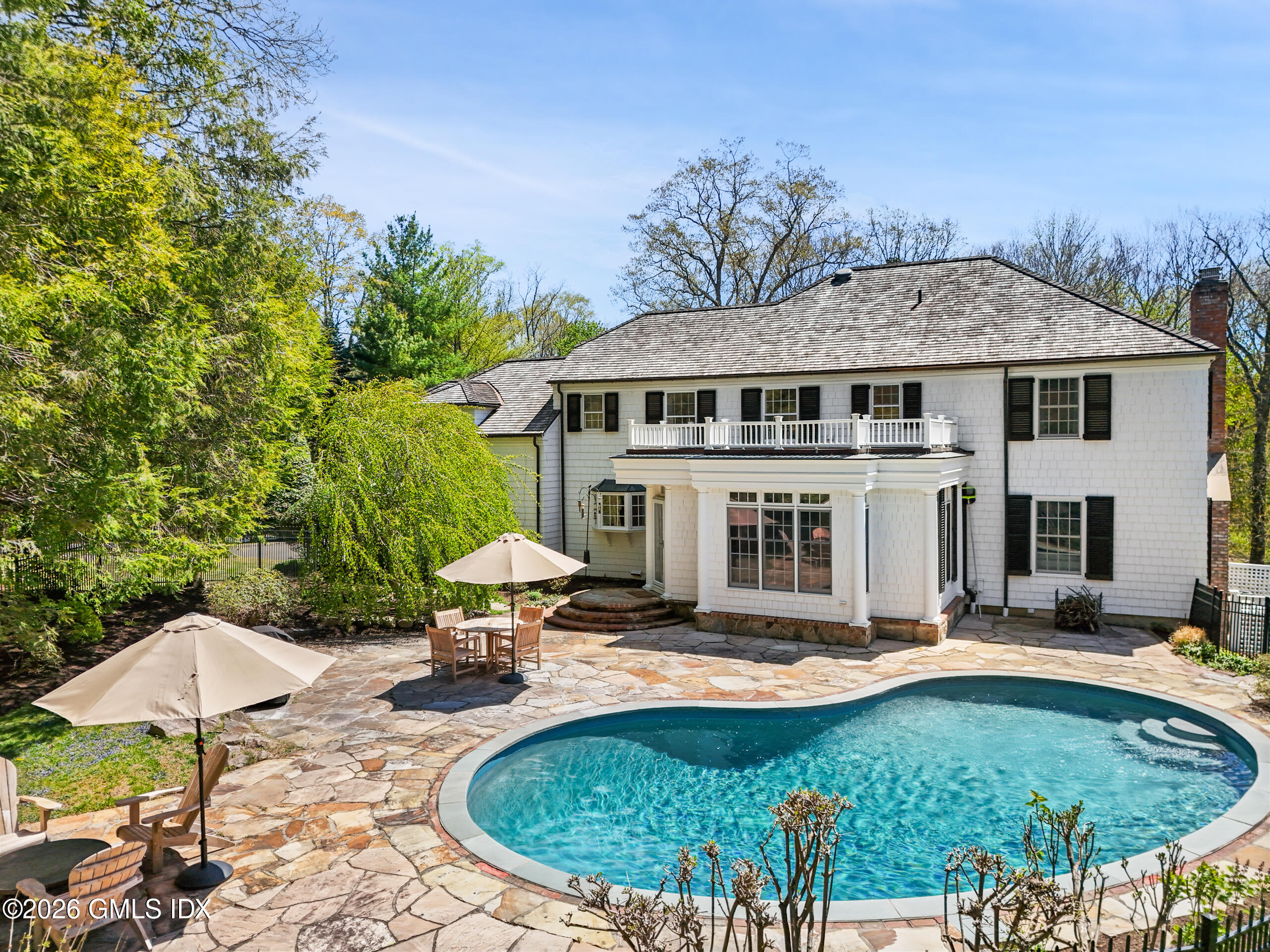 118 Butternut Hollow Road Greenwich, CT 06830 - Photo 36 of 44 a view of a house with swimming pool and furniture