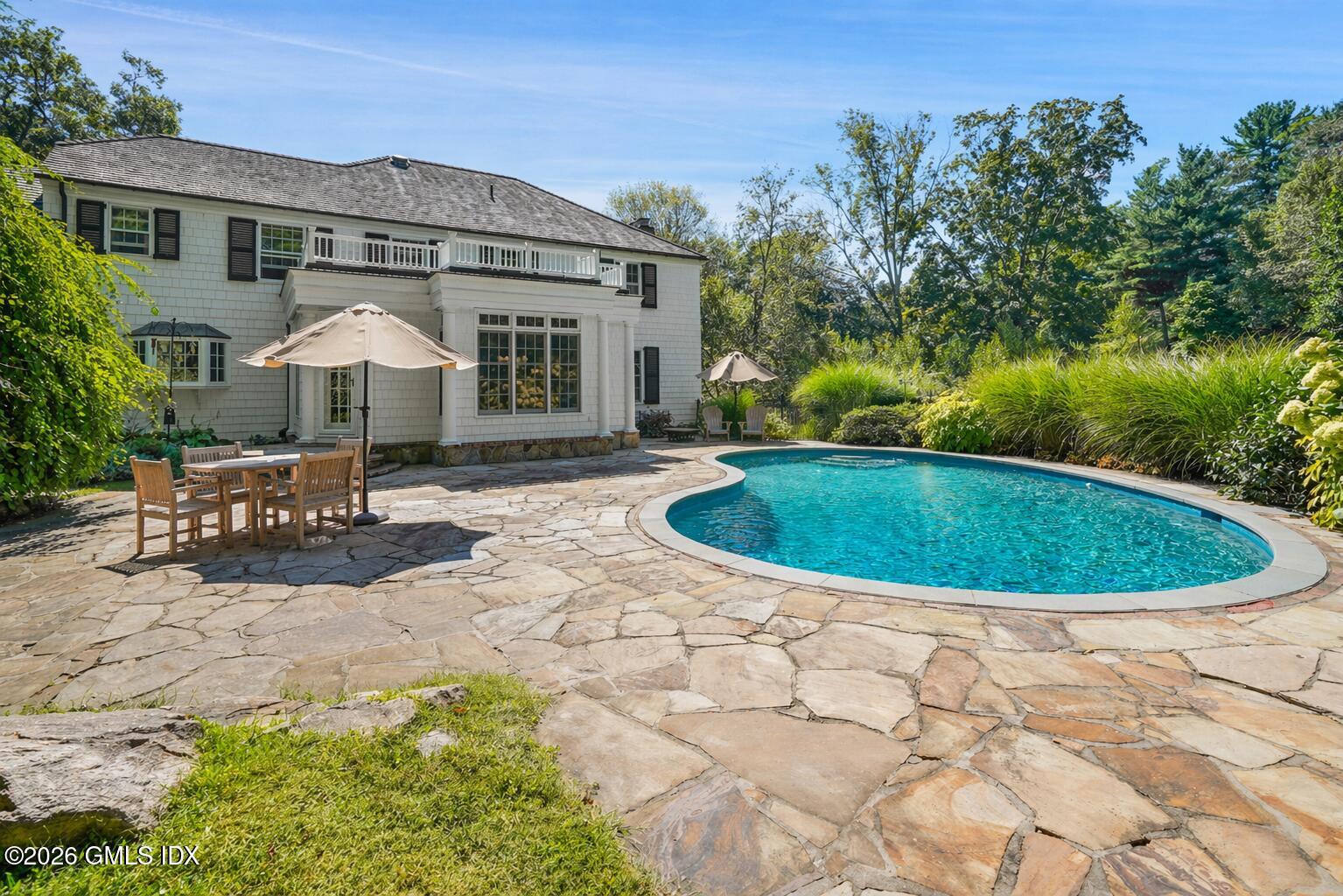 118 Butternut Hollow Road Greenwich, CT 06830 - Photo 38 of 44 a view of a house with backyard and sitting area