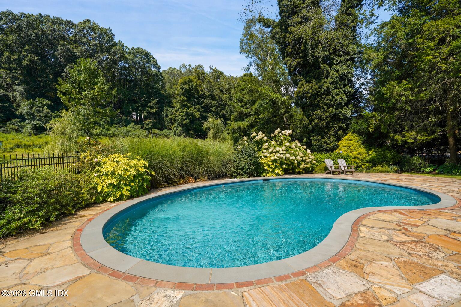 118 Butternut Hollow Road Greenwich, CT 06830 - Photo 40 of 44 a view of a swimming pool with a yard