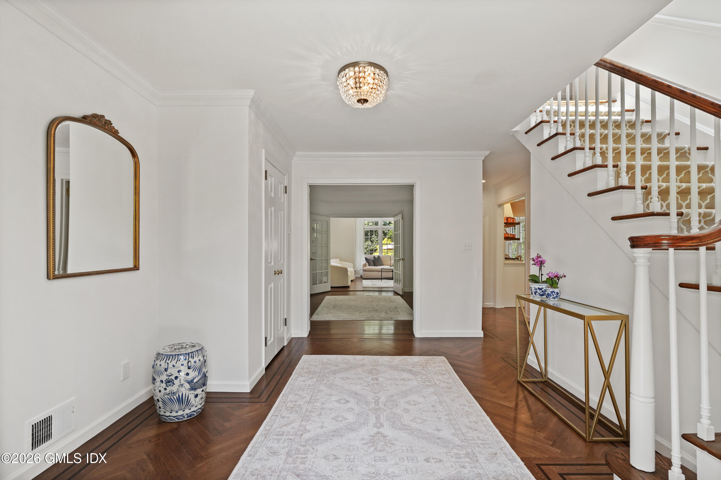 118 Butternut Hollow Road Greenwich, CT 06830 - Photo 5 of 44 a view of a hallway to a livingroom with furniture