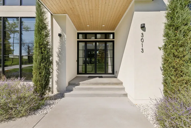 a view of living room with furniture and a potted plant