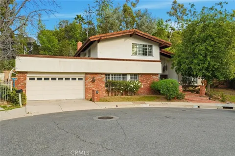 a view of a house with a yard and garage