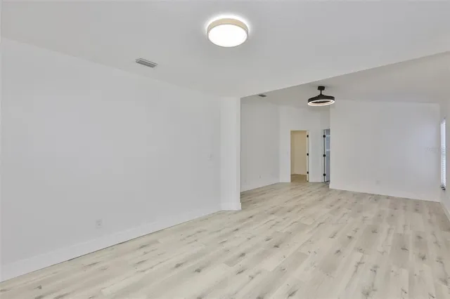 a bathroom with a sink vanity and mirror