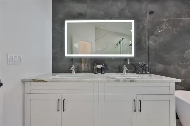 a view of an empty room and wooden floor