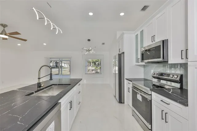 an empty room with large windows