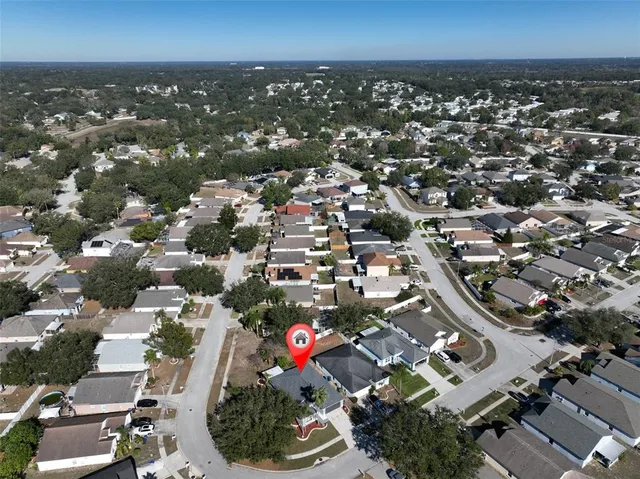 an aerial view of multiple houses with yard