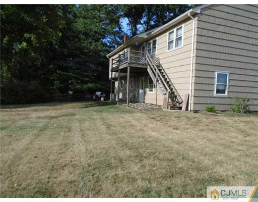 25 Hilltop Road Edison, NJ 08820 - Photo 20 of 21 a view of a house with backyard
