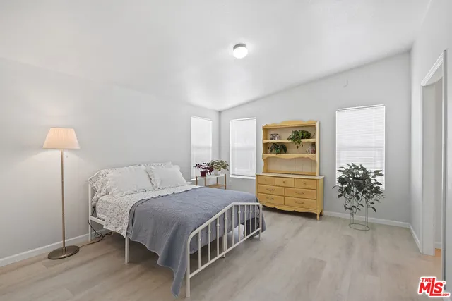 a bedroom with a bed and a table