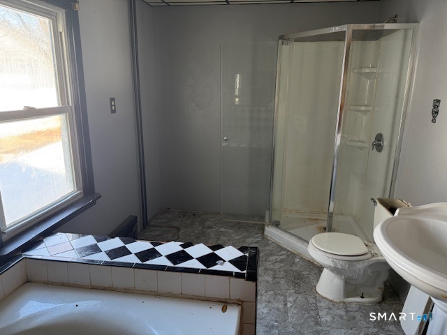 39 Pleasant View Avenue Windham, CT 06226 - Photo 9 of 21 a bathroom with a granite countertop toilet and a shower