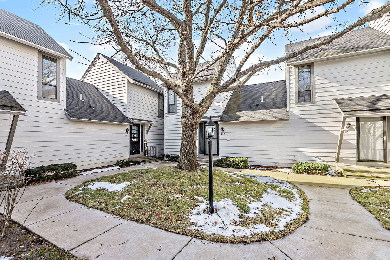 772 Chandler Road, Unit 772 Gurnee, IL 60031 - Photo 1 of 30 a view of a house with a small yard