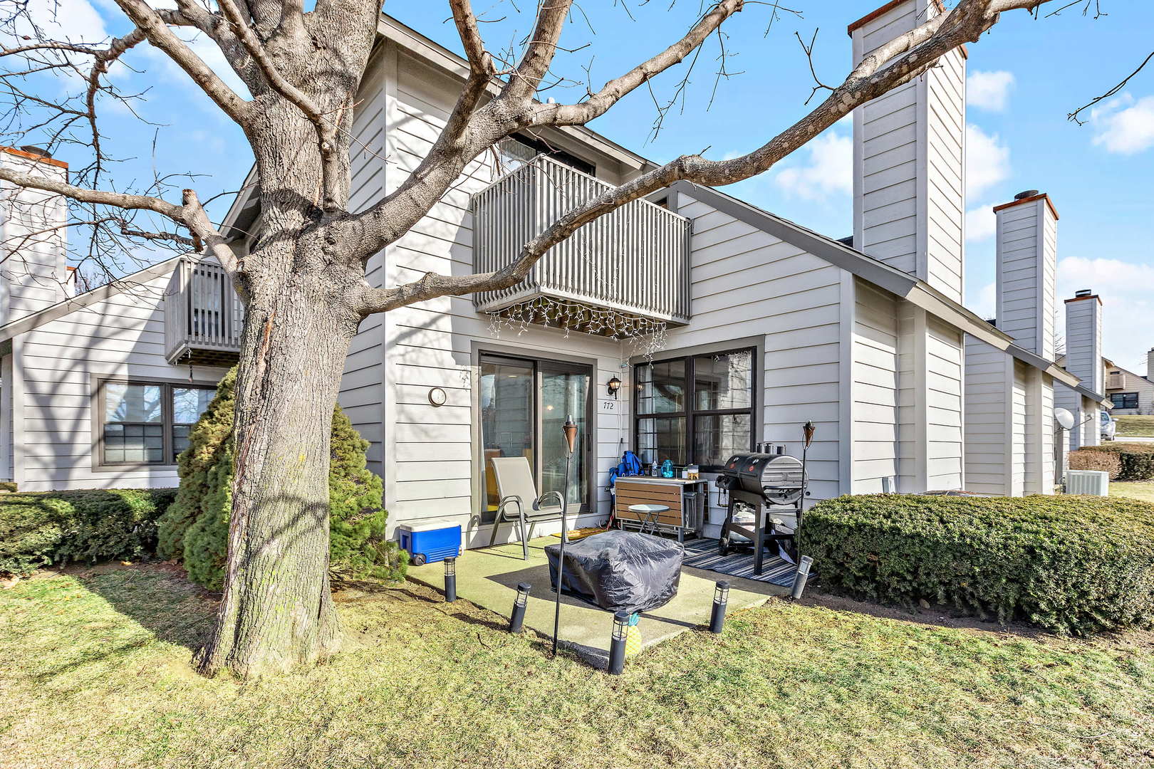 772 Chandler Road, Unit 772 Gurnee, IL 60031 - Photo 23 of 30 a building outdoor space with patio furniture and potted plants