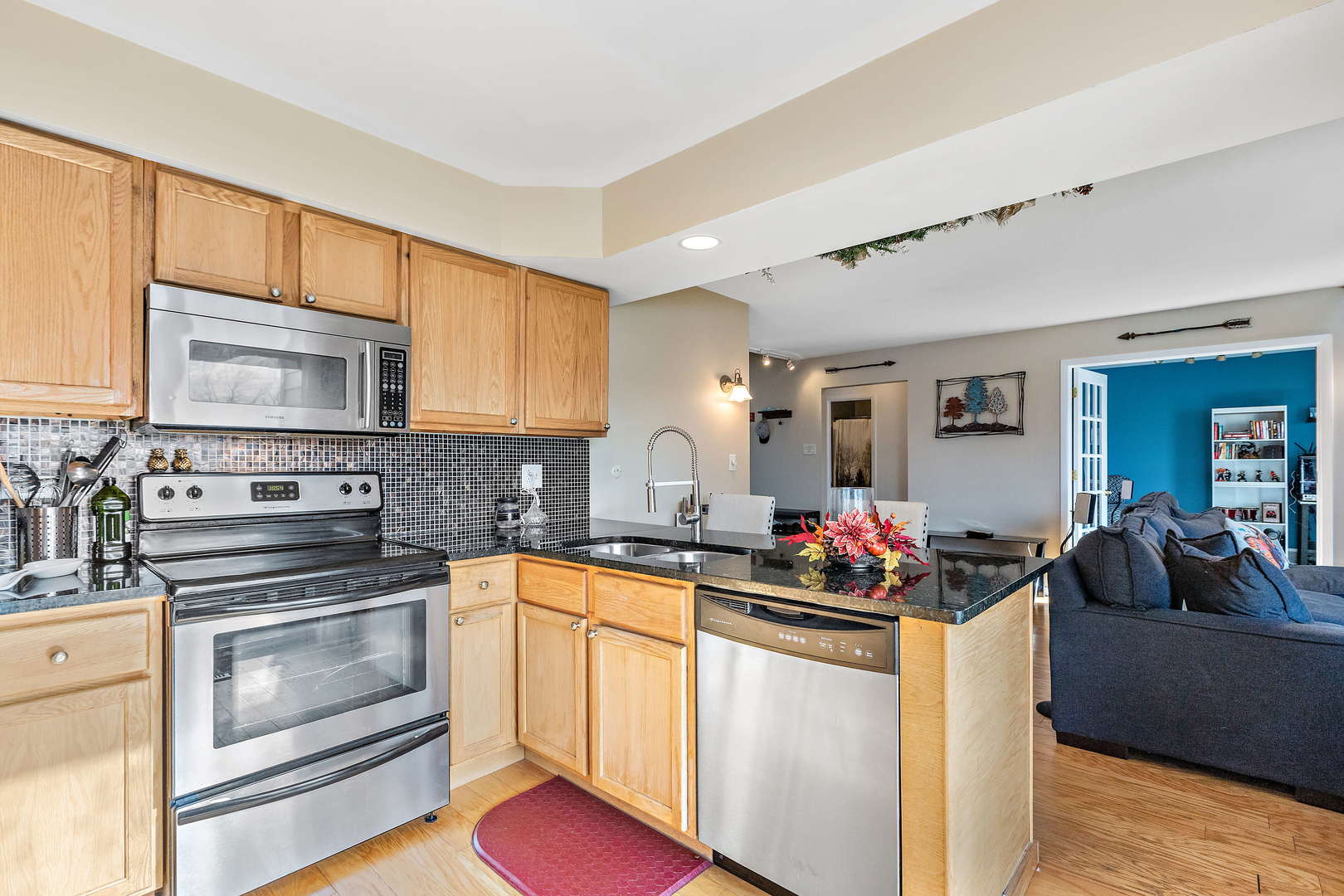 772 Chandler Road, Unit 772 Gurnee, IL 60031 - Photo 9 of 30 a kitchen with a sink stove top oven and microwave