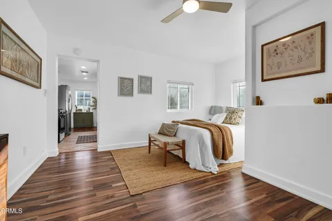 a view of a bedroom with closet and wooden floor