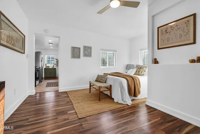 a view of a bedroom with closet and wooden floor
