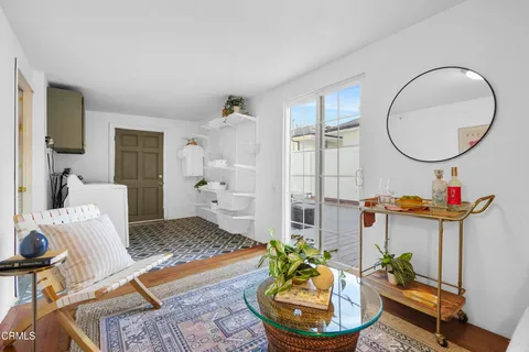 a room with a baby crib and a window