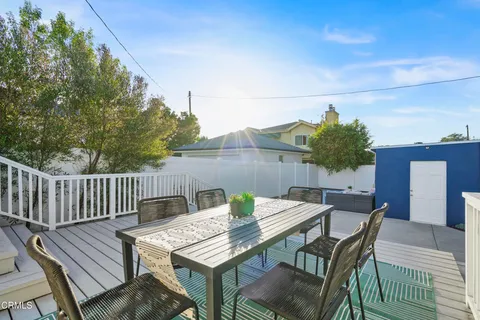 a front view of a house with seating space