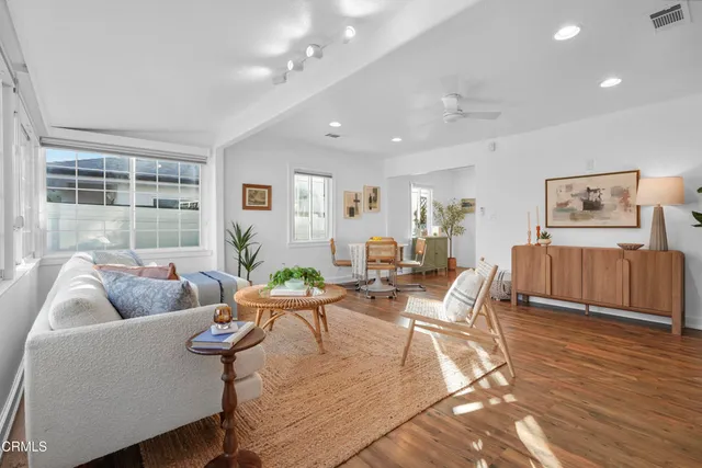 a living room with furniture and a table