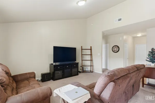 a living room with a couch and a flat screen tv