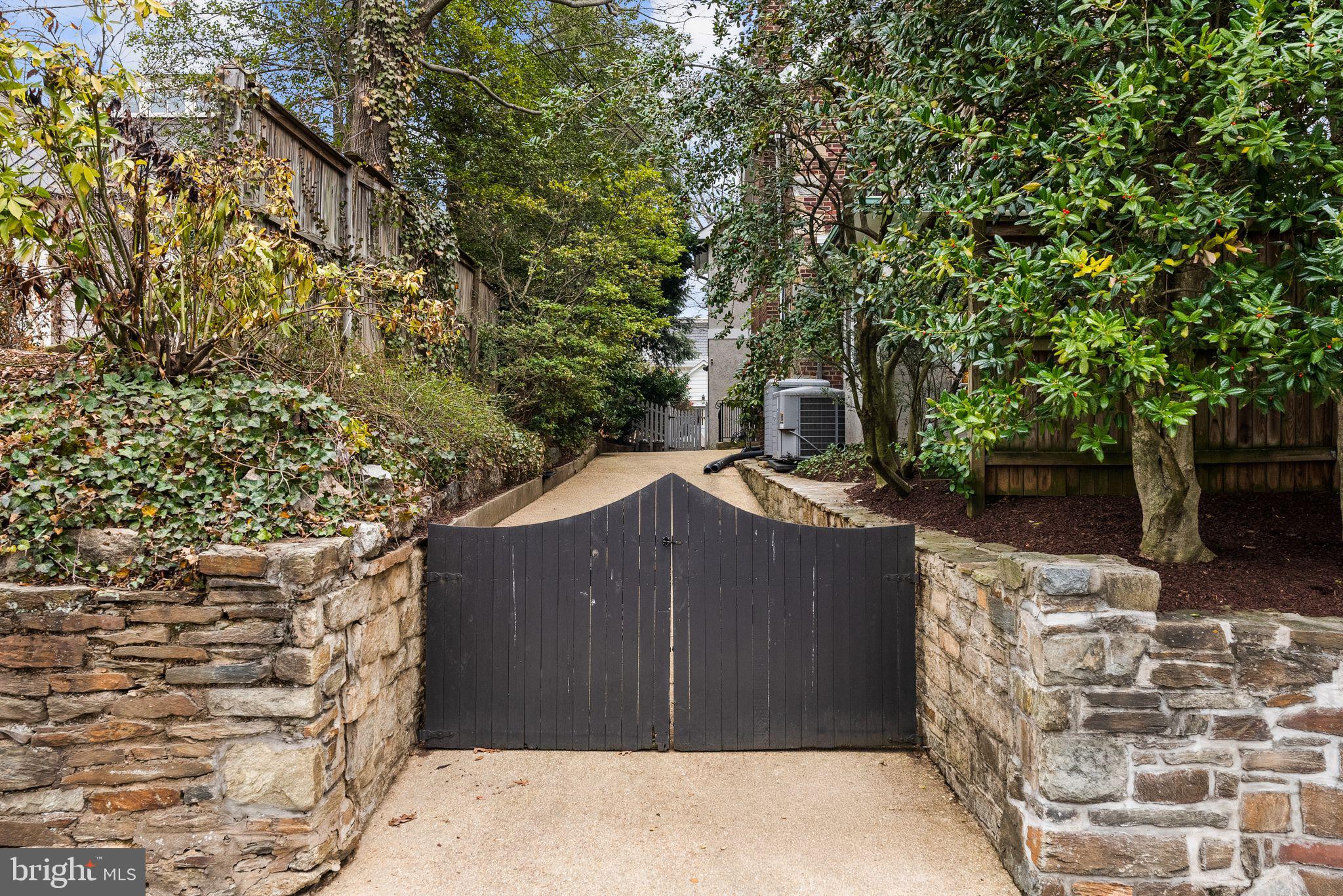 4545 Klingle Street Northwest Washington, DC 20016 - Photo 18 of 19 Private entrance to the driveway off Foxhall Road