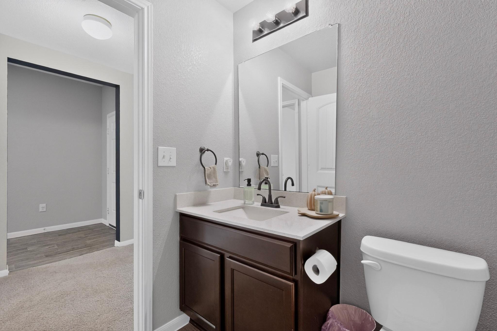 11612 Andesite Road Manor, TX 78653 - Photo 21 of 40 Dark wood vanity in this well-appointed bathroom.