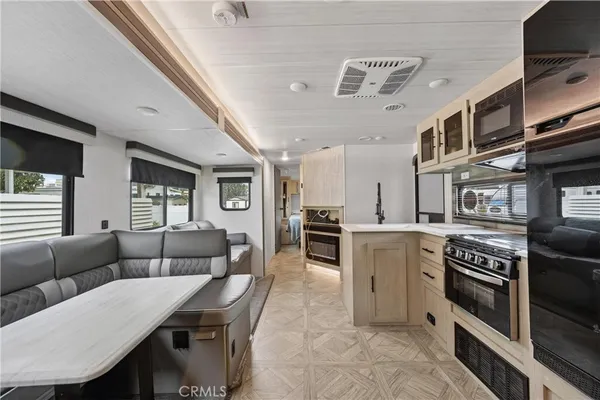 a kitchen with stainless steel appliances granite countertop a stove and a refrigerator