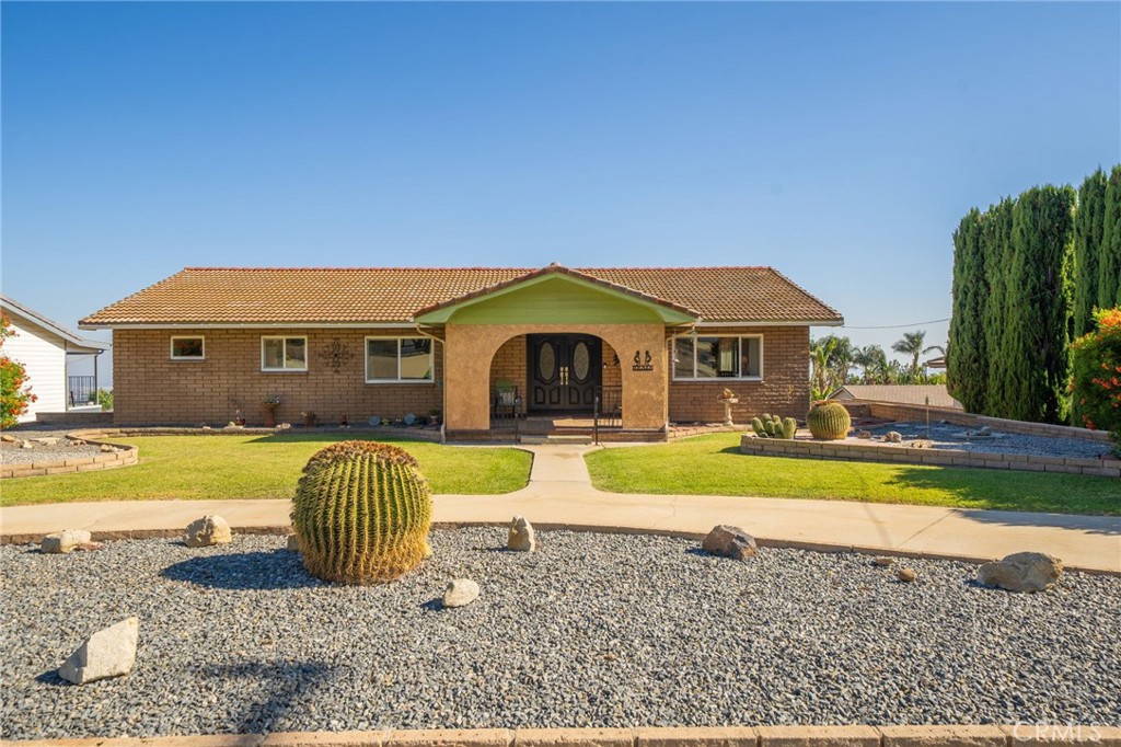 8327 La Senda Road Rancho Cucamonga, CA 91701 - Photo 1 of 1 a front view of a house with swimming pool having outdoor seating
