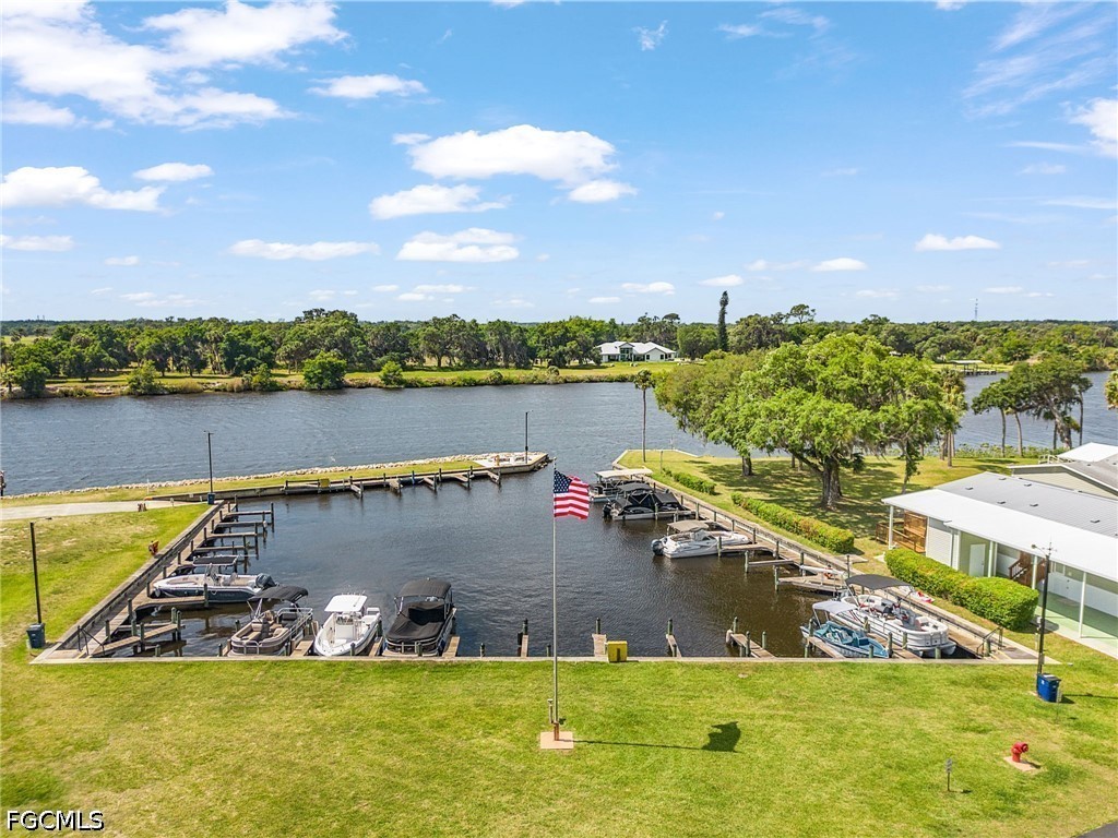5 Erica Street Alva, FL 33920 - Photo 2 of 37 a view of a lake with a yard
