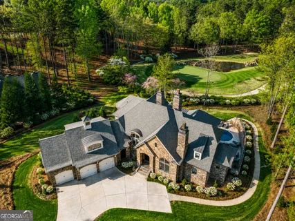 an aerial view of a house having swimming pool