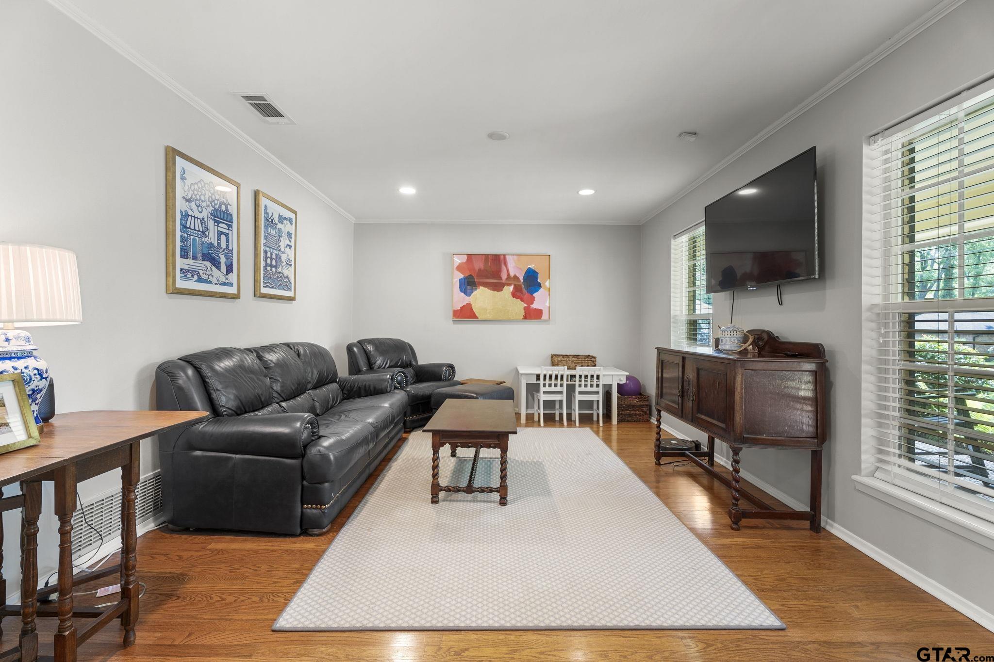 3608 Pollard Drive Tyler, TX 75701 - Photo 2 of 14 a living room with furniture and a flat screen tv