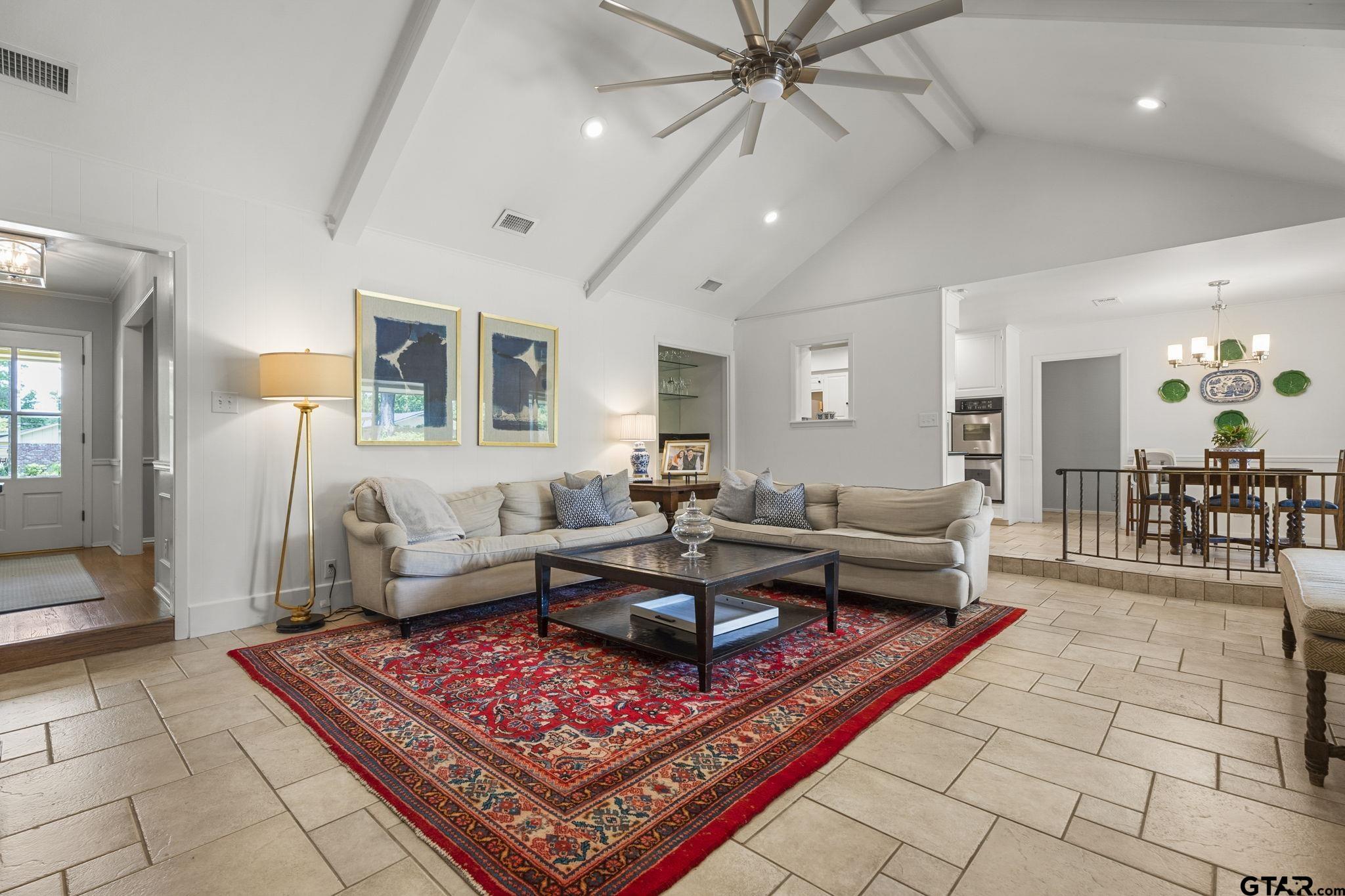 3608 Pollard Drive Tyler, TX 75701 - Photo 3 of 14 a living room with furniture a flat screen tv and a table