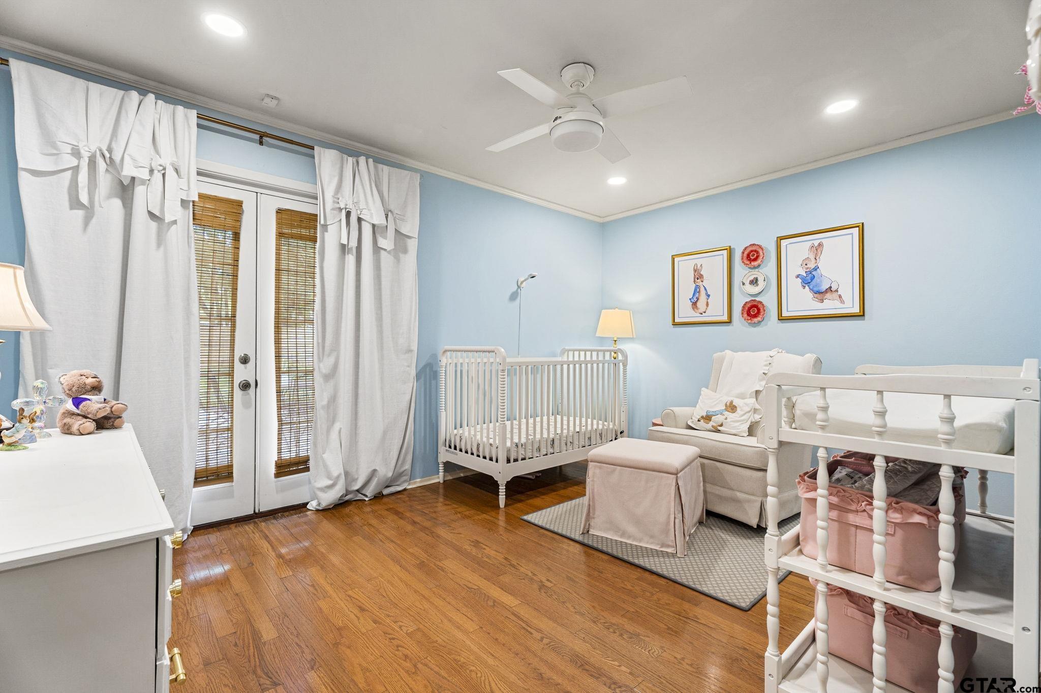 3608 Pollard Drive Tyler, TX 75701 - Photo 9 of 14 a spacious bedroom with a bed and a couch