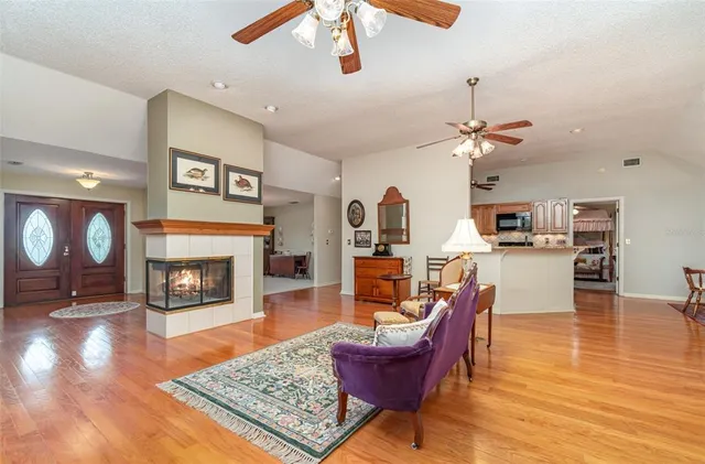 a living room with furniture and a fireplace