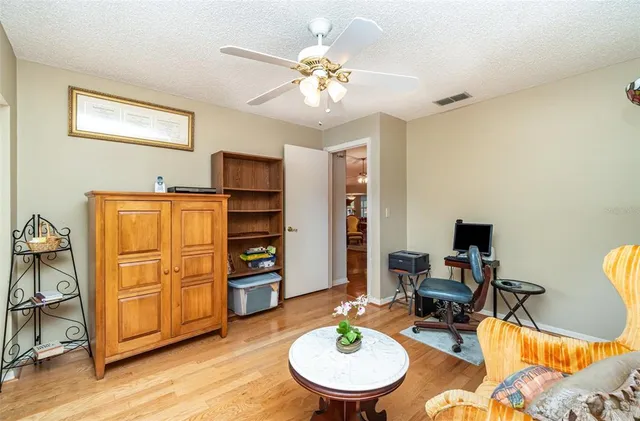 a bathroom with a granite countertop double vanity sink and a mirror