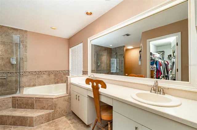 a bathroom with a bathtub and a sink