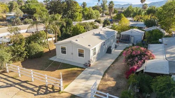 a aerial view of a house with a yard